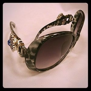 Sunglasses with snap button accents.